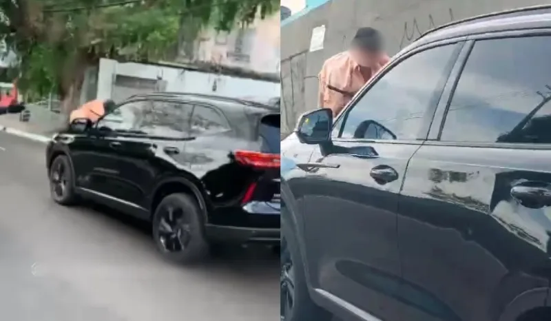 homem pendurado capô carro